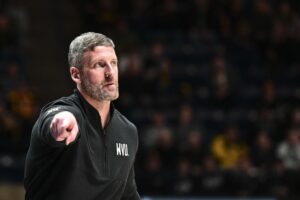 Josh Eilert: Pro agents coming after RaeQuan Battle forcing player to choose between basketball and education